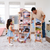 Father and young girl arranging furniture in a customizable multi-story wooden dollhouse for 12-inch dolls