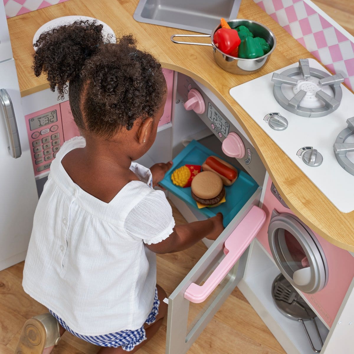 Hands-On Fun: Working doors on washer, oven, microwave, refrigerator and freezer lets kids re-enact everyday household moments.