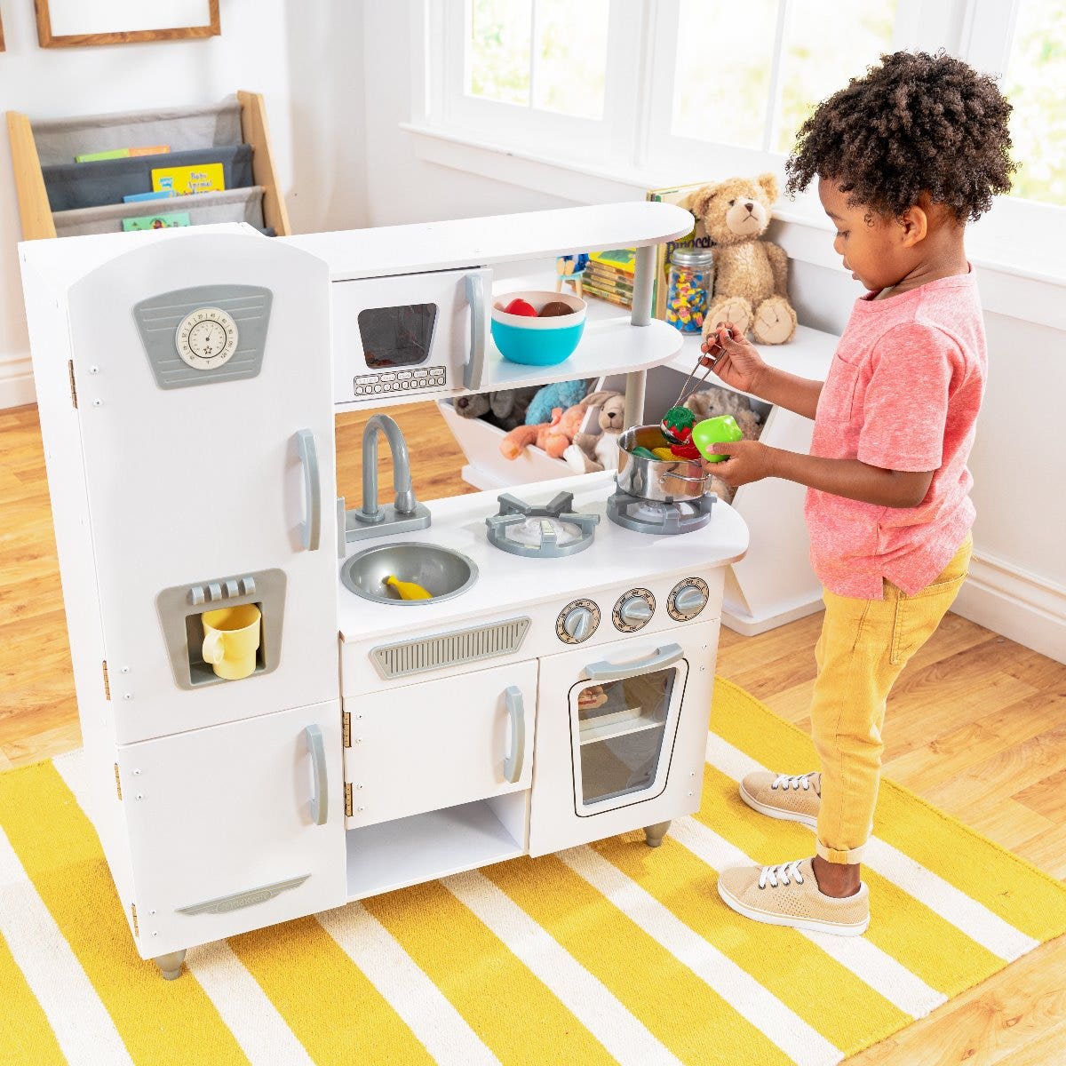 Open Concept: See-through middle and open shelving provides an imaginative play area for kids to serve up food.
