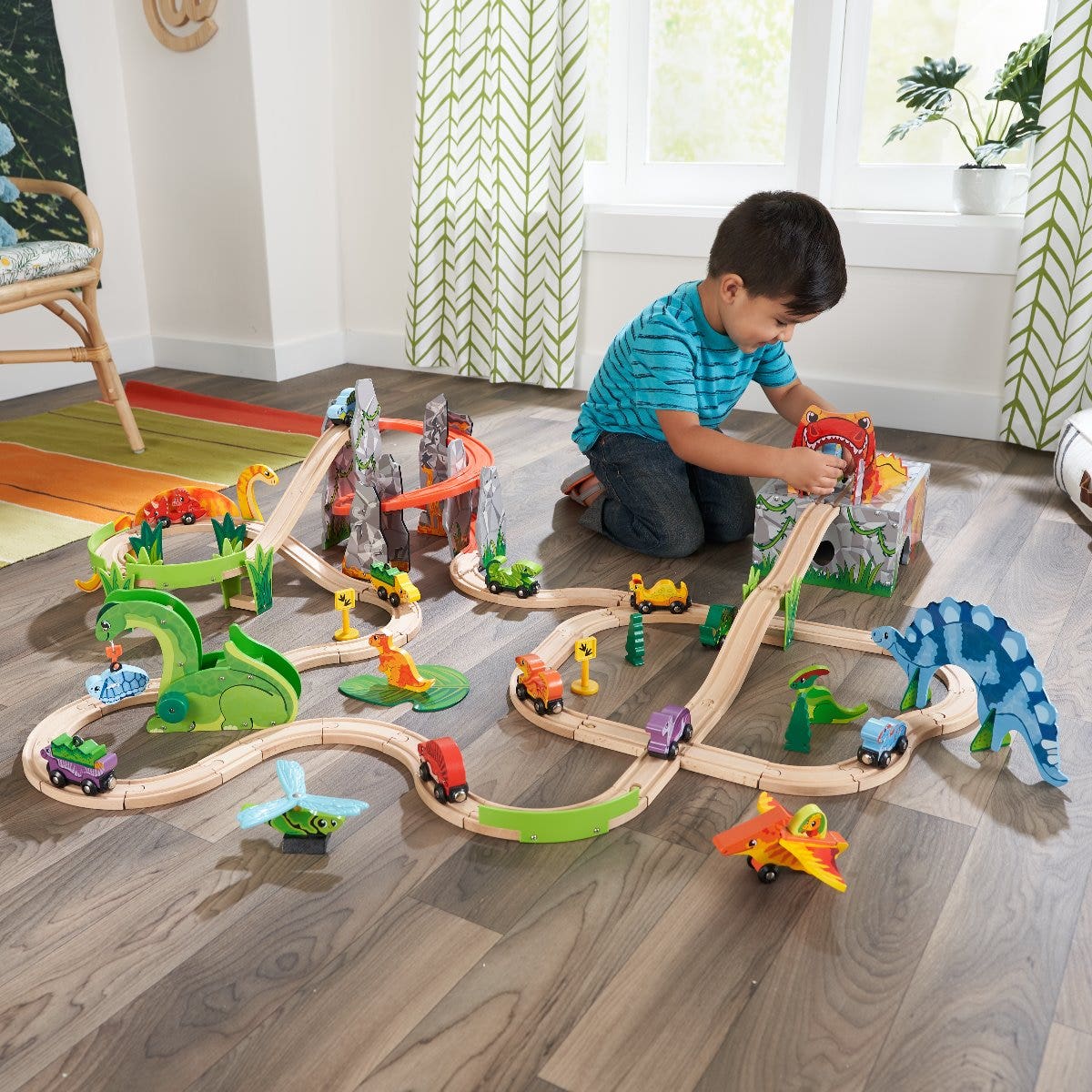 Kid playing with train set